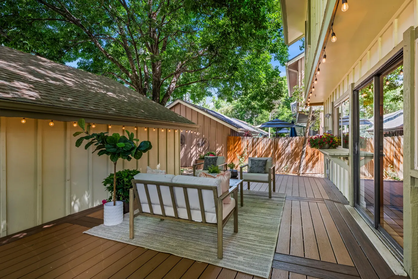 Covered corner of the composite deck beside the detached garage