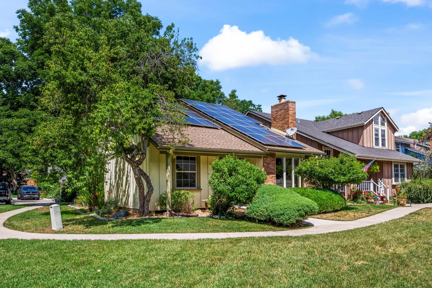 Front of the house with its 8.46 kW rooftop solar array and double-door entry