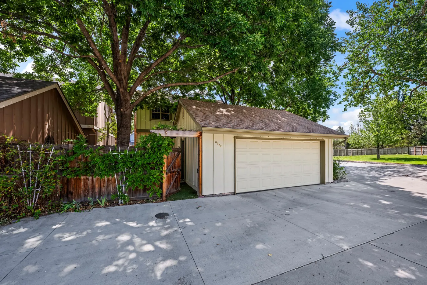 Detached 2-car garage and concrete driveway at 8722 Independence Way