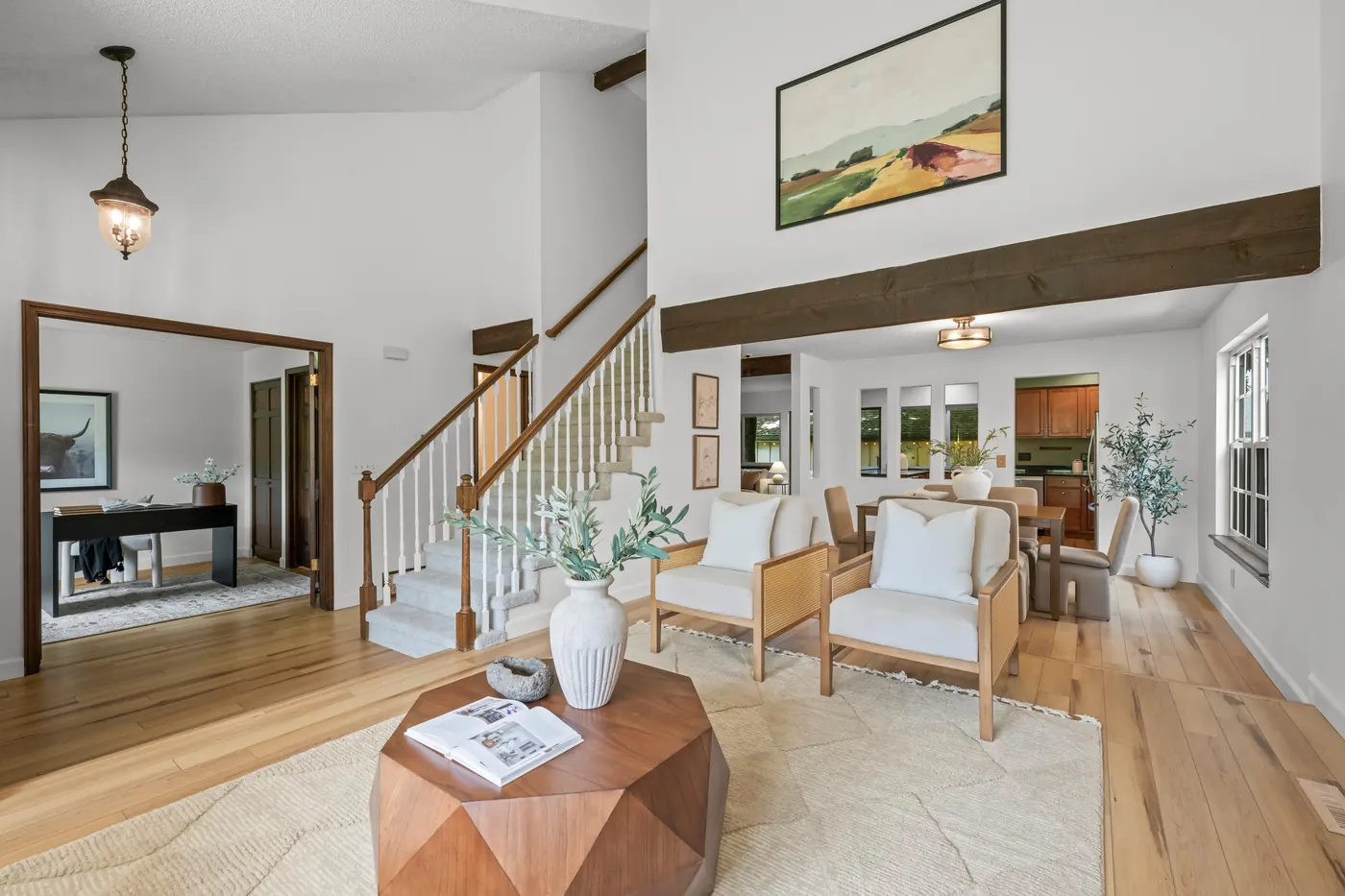 Sunken living room at 8722 Independence Way seen from the foyer step